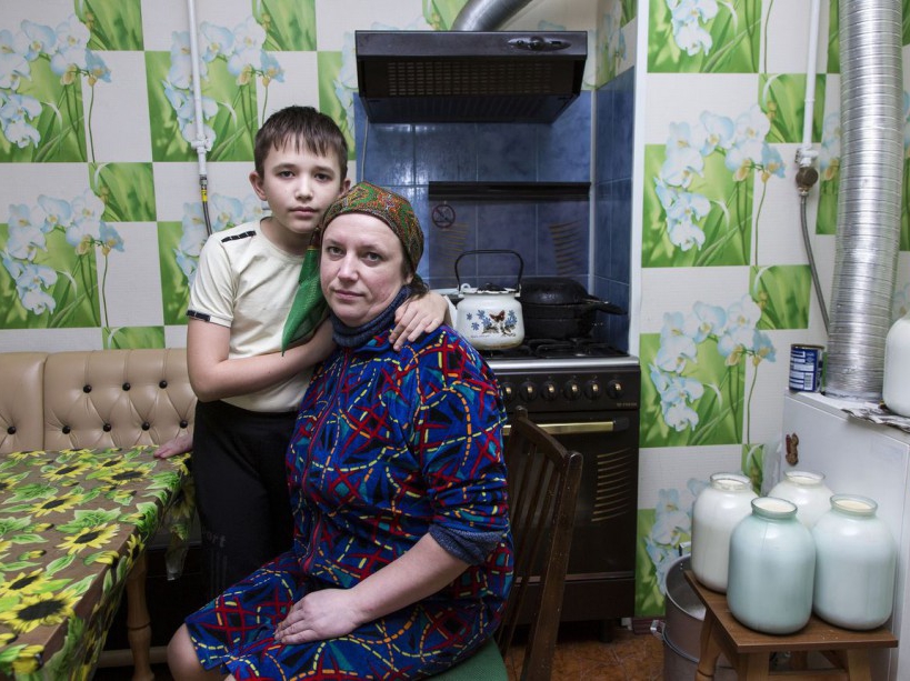 Maxim ,12 years old with her mother Oksana. After being evacuated she returned with her sister to Narodichi town as she did not have other place to go. Thousands of people are still living in contaminated land affected especially children's health. Narodichi, UKRAINE - 02/03/2016. /VALEROQUINTINA_UKR.039/Credit:Quintina Valero/SIPA/1604112020