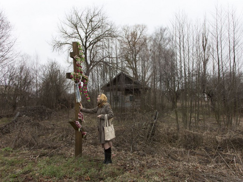 Natalia, school's teacher stands by the entrance of Maksimovichy village, where many houses were abandoned after Chernobyl's disaster. Narodichi district, UKRAINE - 12/03/2016./VALEROQUINTINA_UKR.050/Credit:Quintina Valero/SIPA/1604112020