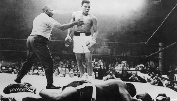 (FILES) A picture taken 26 May, 1965, in Lewiston, Maineduring the world heavyweight boxing championship, at the end of which the American Muhammad Ali (Cassius Clay) (C) won against his compatriot Sonny Liston (R) after a one minute fight with Joe Walcott (L) as a referee. Ali celebrated his 65th birthday privately in Phoenix, Arizona 17 January, 2007 in his suburban home while his legacy was honored and marketed to a new generation of fans. Ali and his wife Lonnie moved to Arizona from Michigan four months ago, where warmer weather will help comfort "The Greatest" as he deals with Parkinson's disease that has weakened his body but not his mind.